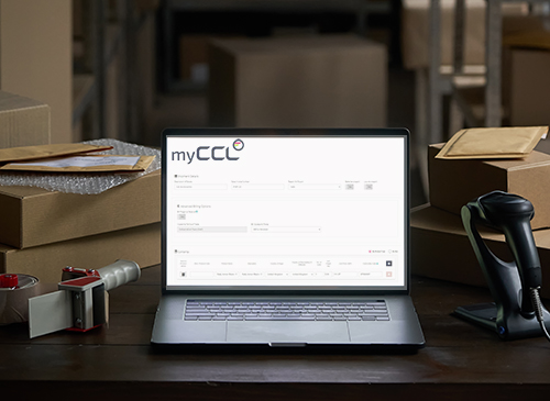 myCCL Transport Management System showing automated Commercial Invoice management on a laptop screen